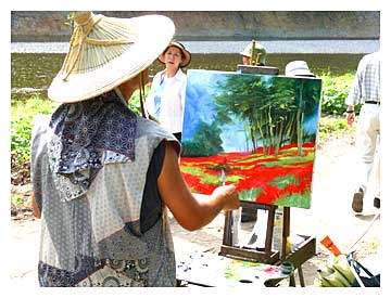 巾着田の彼岸花を描く画家